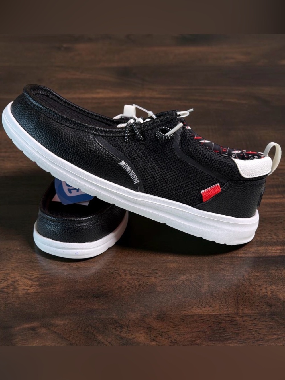 Hey Dude Black Slip-On Loafers with White Sole and Red Accent